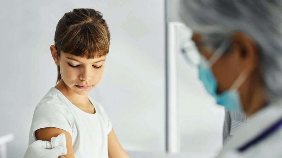 Picture of girl having a vaccine