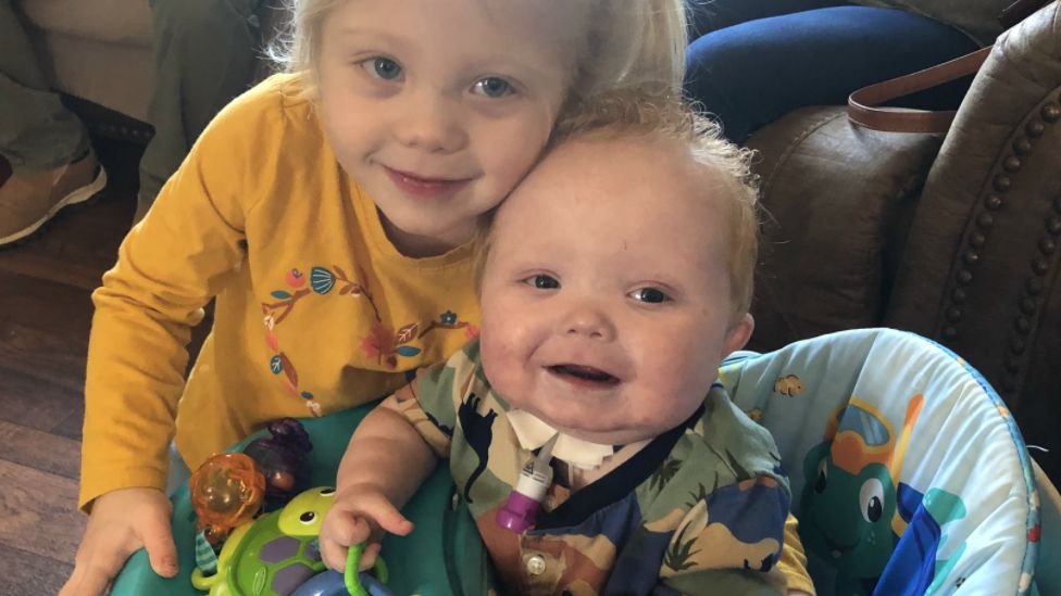 Easton at home with his sister