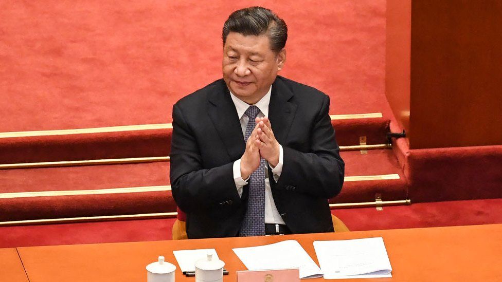China's President Xi Jinping applauds during the opening ceremony of the Chinese People's Political Consultative Conference (CPPCC) at the Great Hall of the People in Beijing on March 4, 2022.