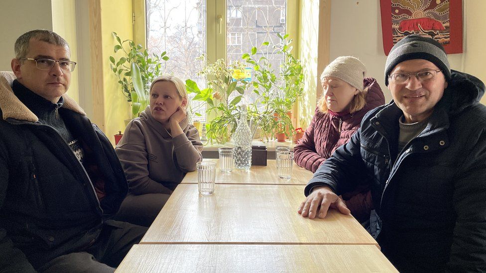Oksana Gusak with her family in a cafe