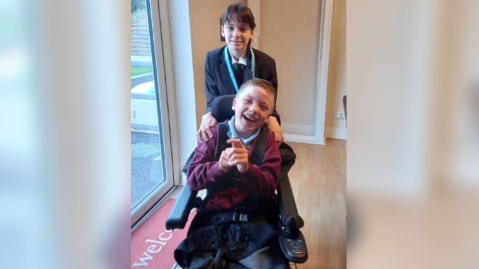 Izzy Lally with brother Ryan in wheelchair