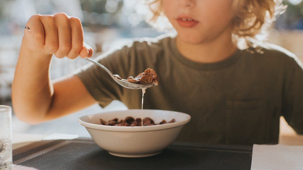 Child eating bowl of cereal