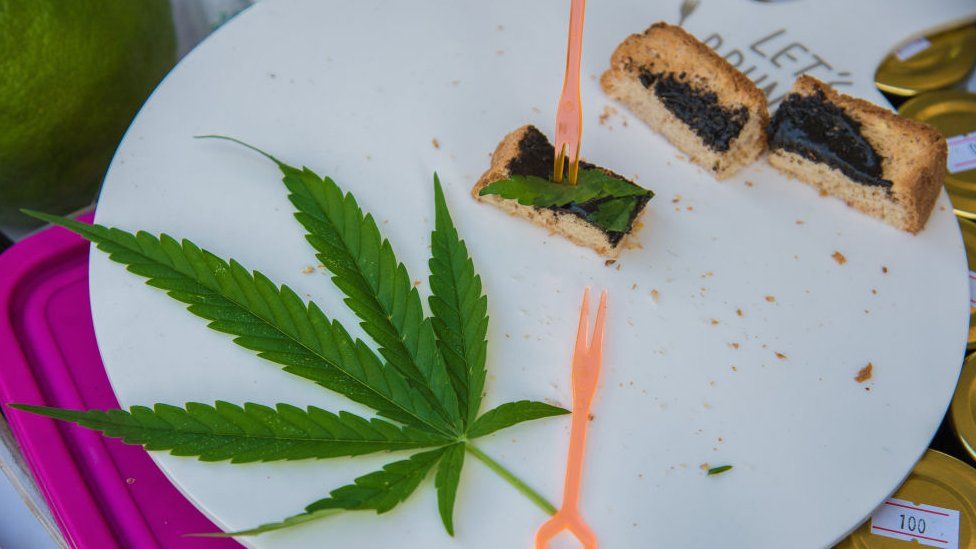 A cannabis leaf seen on a plate of a cannabis toast during a Thai food fair