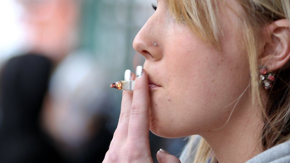 A woman smokes a cigarette on March 12, 2012 in London, Ontario.