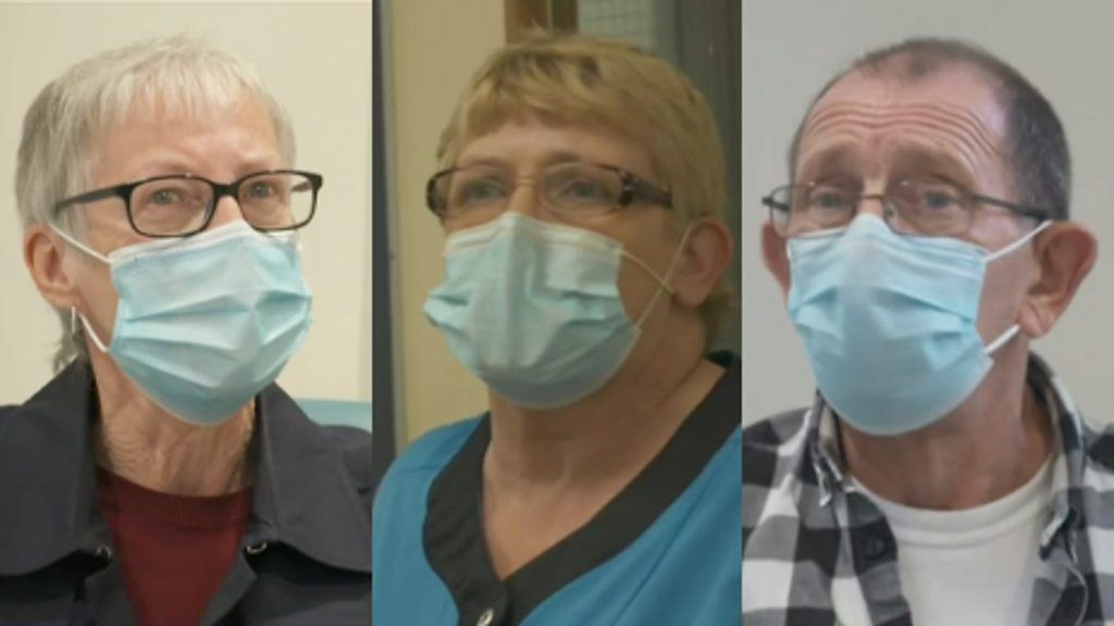 Three people with masks on