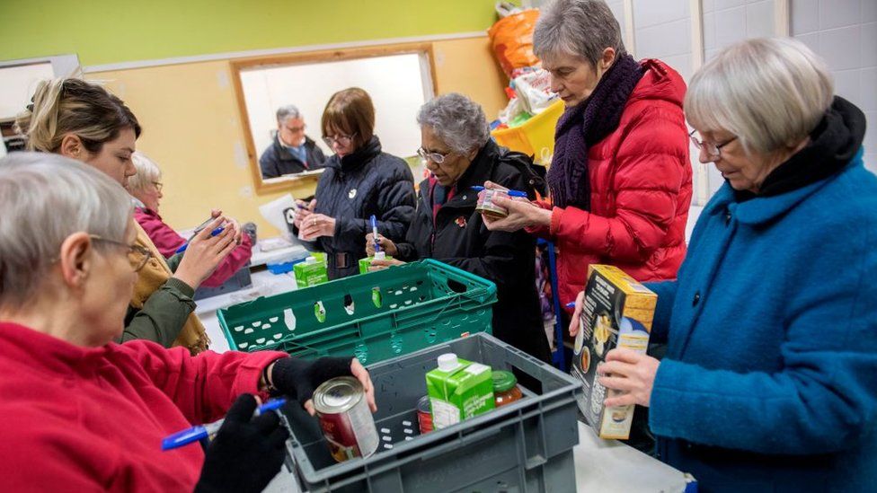 Foodbank volunteers sort through donations at the warehouse before distributing them to local foodbanks on January 28, 2019 in Stalybridge, England.