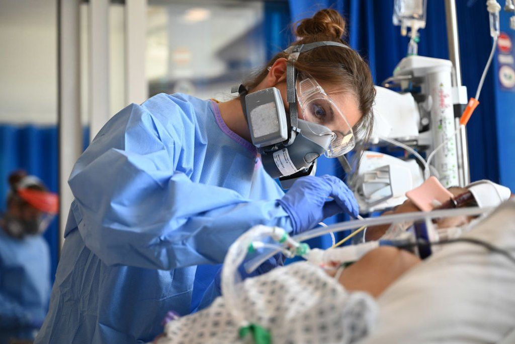 Staff care for a patient in critical care at Royal Papworth hospital in Cambridge
