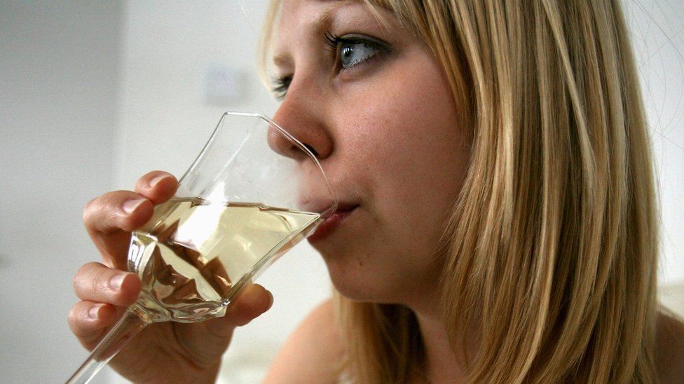 Woman drinking glass of wine